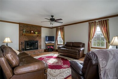 Large family room with an inviting hearth fireplac