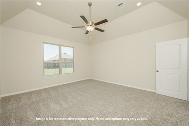 Empty room with a tray ceiling, carpet, recessed lighting, and a ceiling fan
