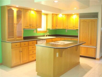 Kitchen. This custom built kitchen even has refrig