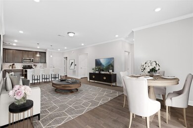 The room flows nicely with hardwood floors through
