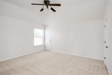 Unfurnished room featuring lofted ceiling, light colored carpet, and ceiling fan