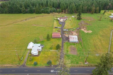 Main house in the back, second home/rental house in front, barns in the middle. Left of this is approximately 10 acres of farmland and to the right is approximately 5 acres.