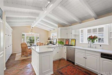Kitchen with carrara marble countertops and a brea