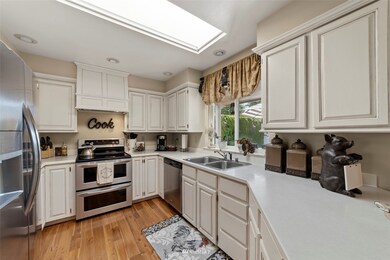 Remodeled kitchen with skylight and upgraded stainless steel appliances