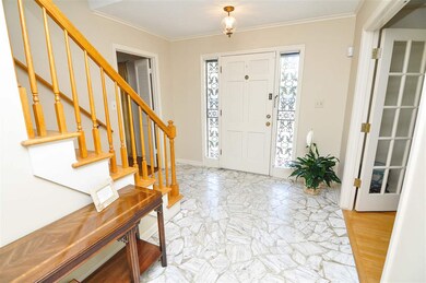 The entry hall separates the large den and separat