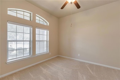 Unfurnished room featuring light carpet, ceiling 