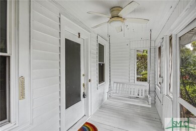 Screened in front porch with porch swing