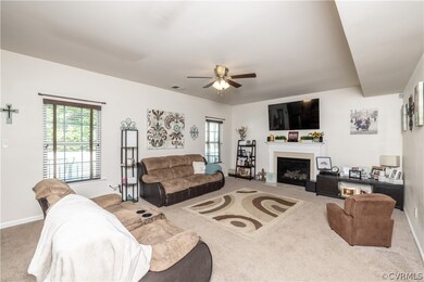 The family room is spacious and features a firepla