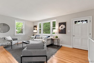 Living room featuring light wood-style floors and