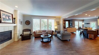 Family room with lots of lighting and new plank ti
