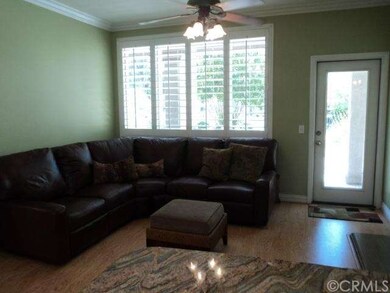 Family Room with Shutters and Door to Backyard. 
