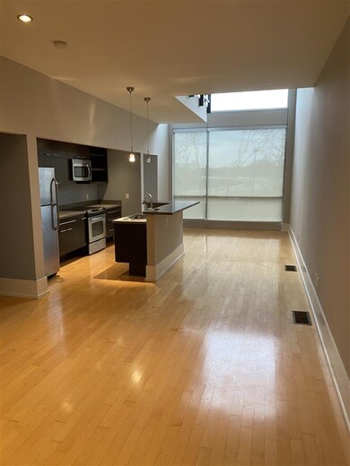 View from the back  door of great room kitchen com