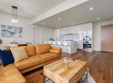 Living room with visible vents, recessed lighting