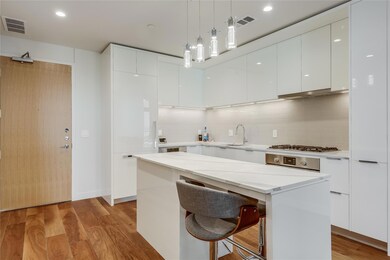 Kitchen with modern cabinets, white cabinets, dec