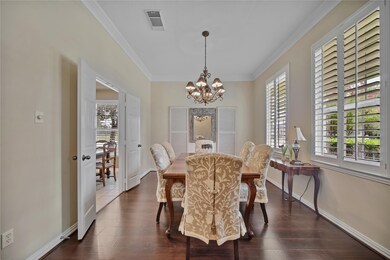 Another view of the formal dining room with French doors to the kitchen.