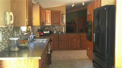 Kitchen looks out in to family room where you can 