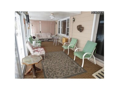 The enclosed sunporch is spacious enough for large