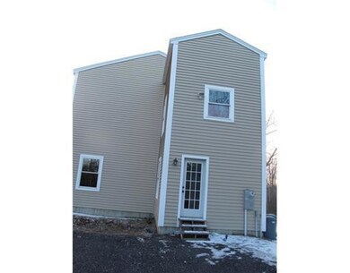 Exterior Front. Side entrance to mud...