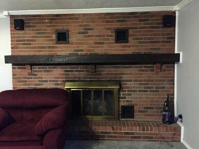 Den/Family/Great Room. floor to ceiling brick hart