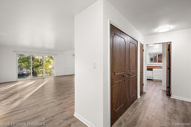 Hallway with light wood finished floors