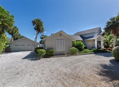 Side of home and garage with shell drive. 