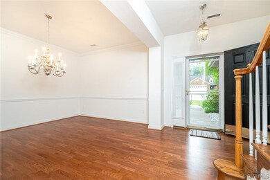 Entryway with dark hardwood / wood-style flooring