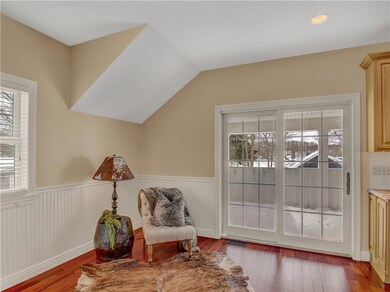Sitting area to the left of the kitchen - hardwood
