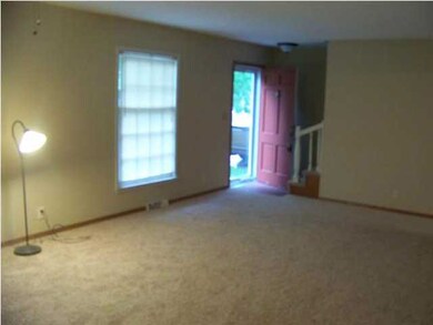 The living room has 2 large windows that let in lo