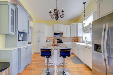 The kitchen features a center island breakfast bar