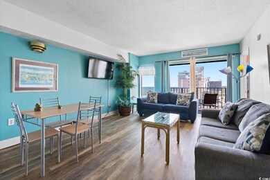 Living room with dark hardwood / wood-style floori