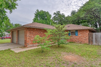 Ranch-style house featuring brick siding and a shingled roof