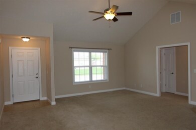 The large window in the living room provides a gor