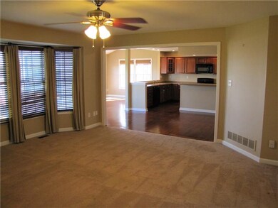 Family room with plenty of natural light and open 