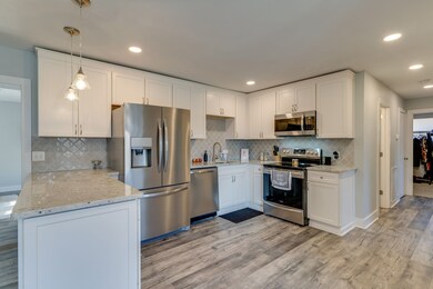 Crisp white cabinets are thoughtfully designed to maximize space.