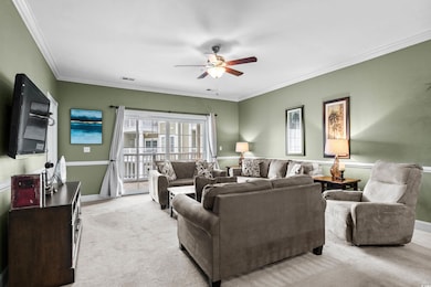 Living area with a ceiling fan, light colored carp