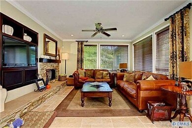 Spacious family room has a built- in entertainment