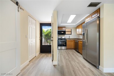 Kitchen with light wood-style flooring, visible ve