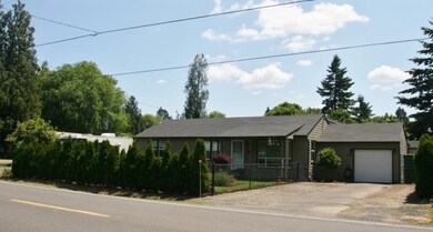 Fully fenced front yard, with access gates.