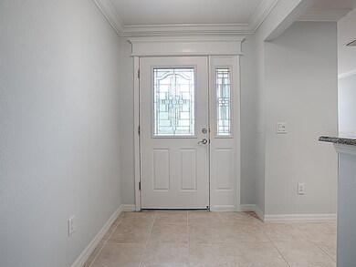FOYER WITH LEADED GLASS FRONT DOOR WITH SIDELIGHT 