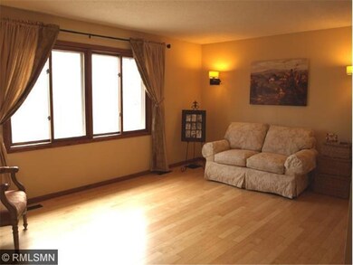 Living Room looks out over the Dining and Kitchen 