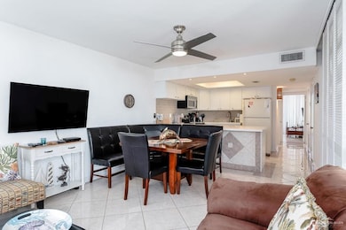 Living area featuring light tile patterned floors