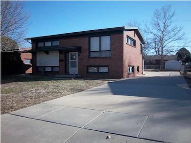 Large driveway leads to a 30 X 24 garage and paved