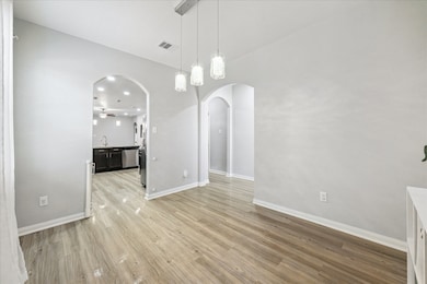 Formal dining looking toward convenient kitchen ar
