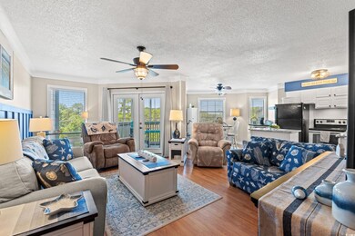 Living room with a textured ceiling, ceiling fan, 
