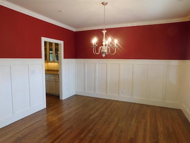 Lovely formal dining room with custom wainscoting. 