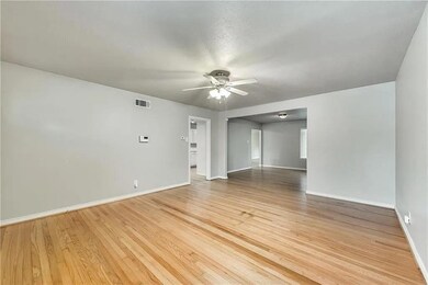 Spare room featuring ceiling fan and light hardwood / wood-style flooring