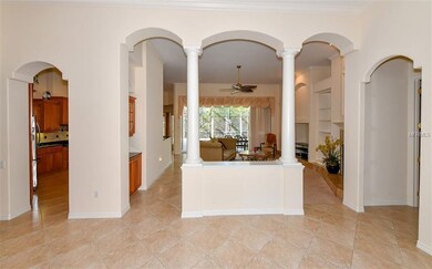 Open floor plan with high volume ceilings, crown moldings, arches and niches