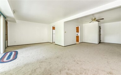 The living room is well-lit through the glass door