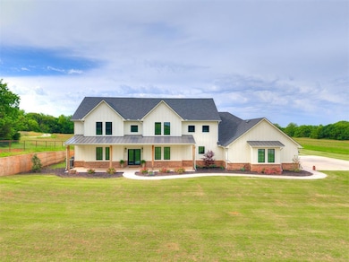Modern farmhouse with a standing seam roof, board 