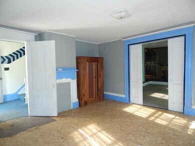 Left hand living room with pocket doors